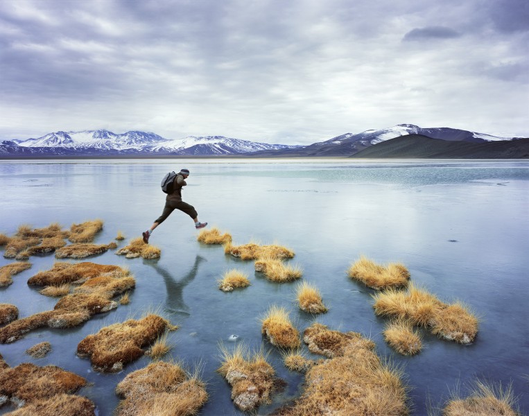 049 ja man jumping near lake Jonathan Andrew