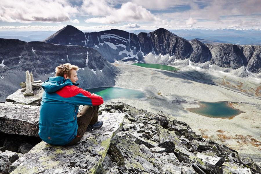 Erland sitting on trolltinden Jonathan Andrew